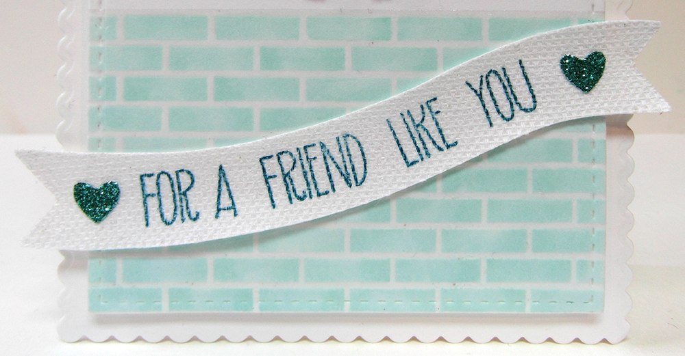 Close up picture of the sentiment, stamped on a canvas banner.