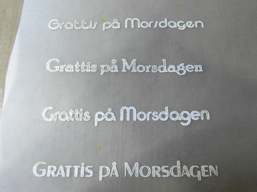 Close up of printed and embossed sentiments.