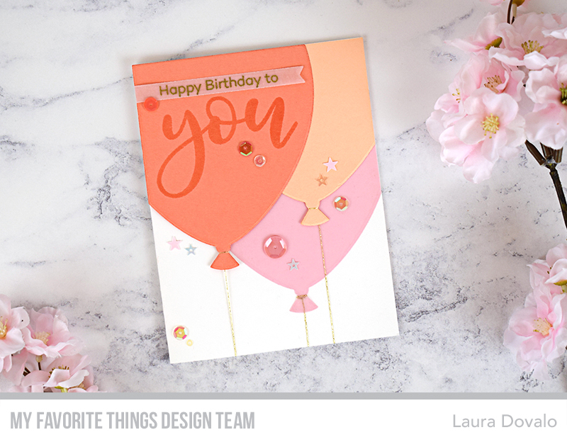 Birthday card with large balloons in coral.