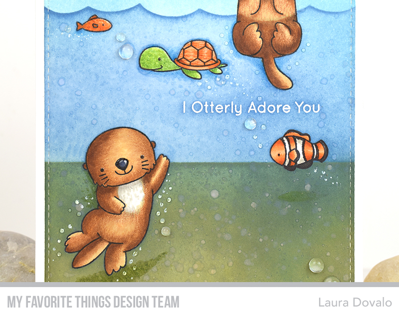 Close up of card with otters.