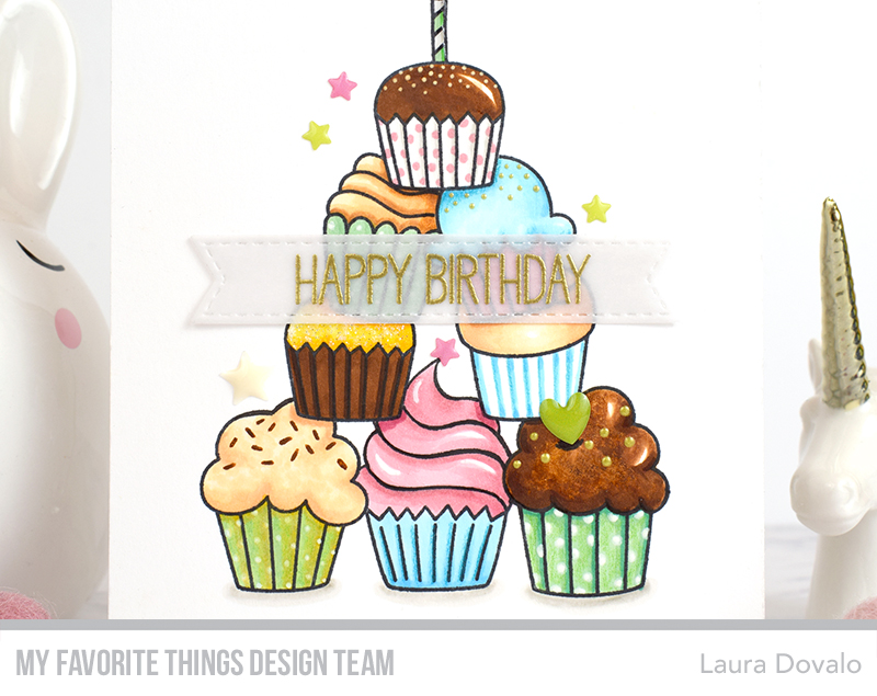 Close up of card with colorful cupcakes.