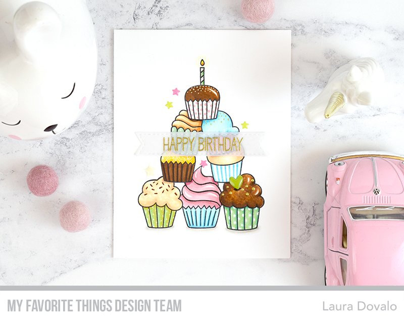 Cenital view of clean and simple car featuring a pyramid of colorful cupcakes.