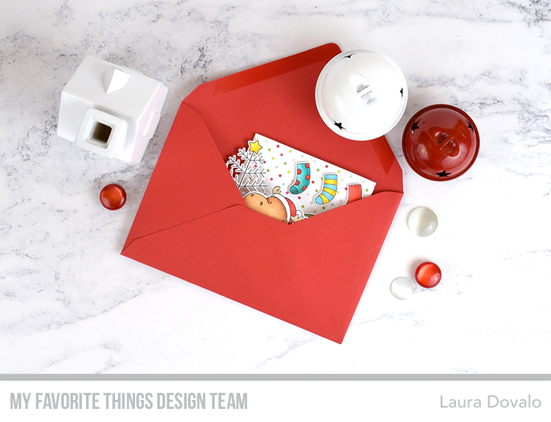 Christmas box card with moose inside of a red A2 envelope.