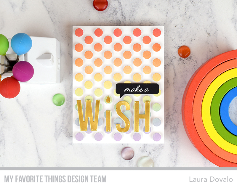 Cenital view of card with rainbow dots.