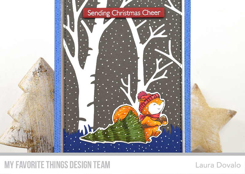 Close up of card with trees.