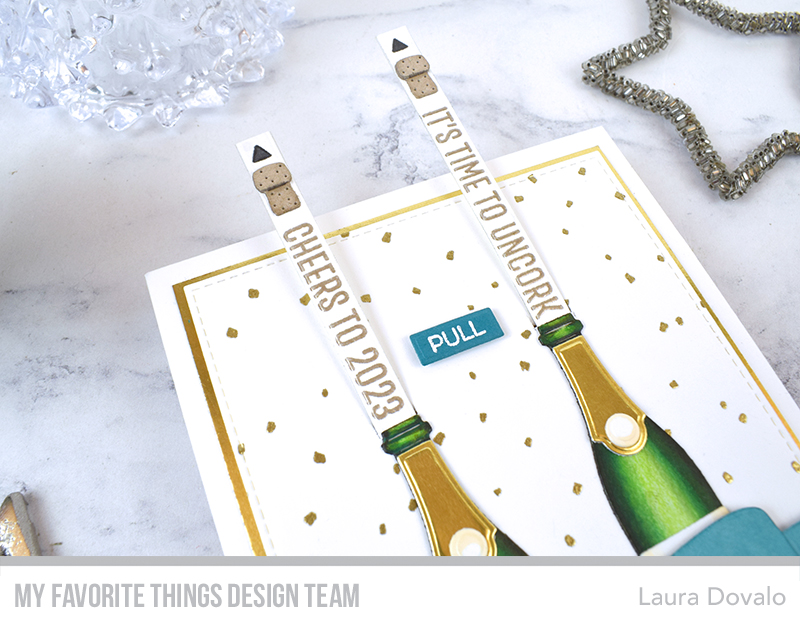 Close up of interactive champagne bottle card.