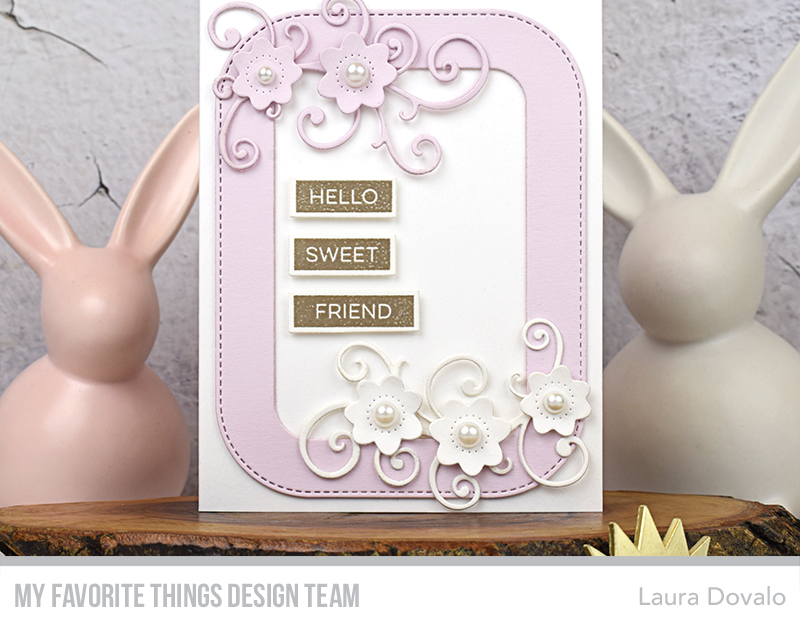 Close up of card with frame and flowers.