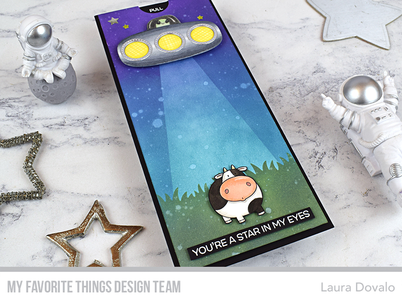Interactive card with UFO abducting a cow.