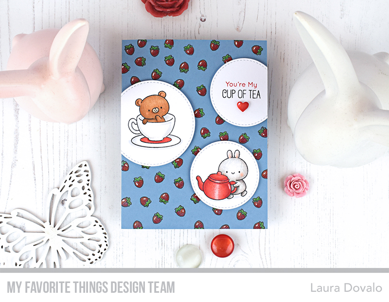Cenital view of tea themed card with strawberries.