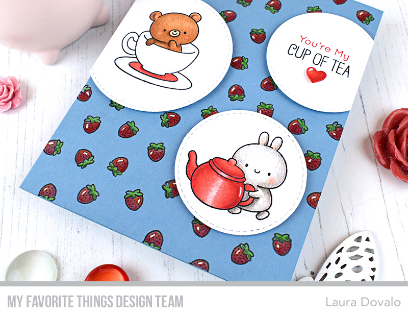 Close up of tea themed card with strawberries.
