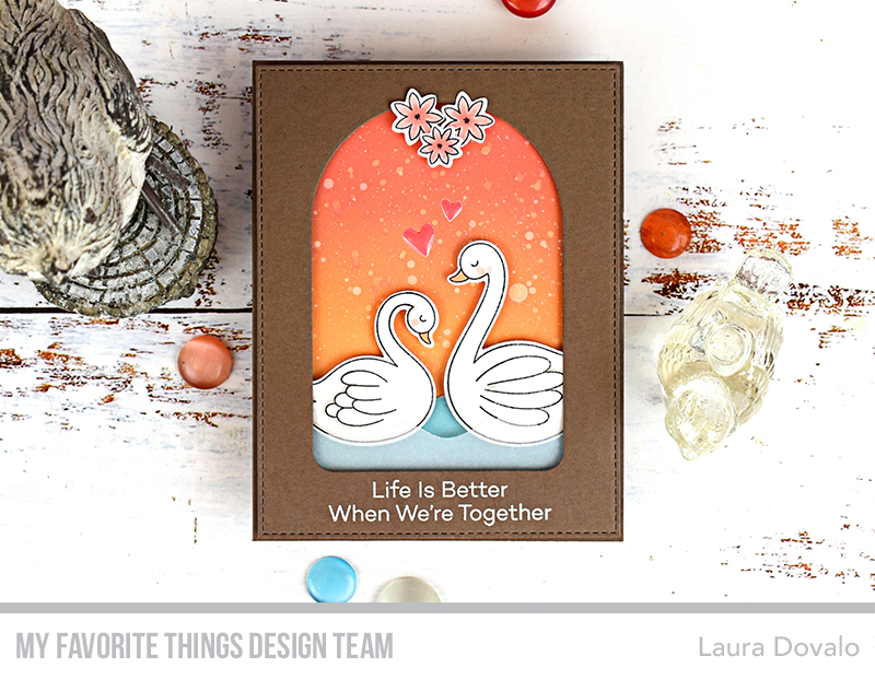 Cenital view of card with swans and arched window.