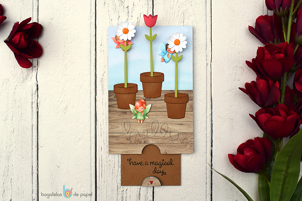 Tarjeta interactiva con flores que crecen y productos de Lawn Fawn.