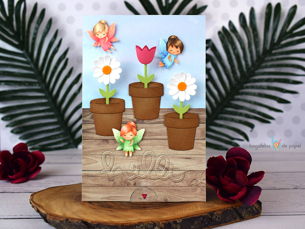 Tarjeta interactiva con flores que crecen y productos de Lawn Fawn.